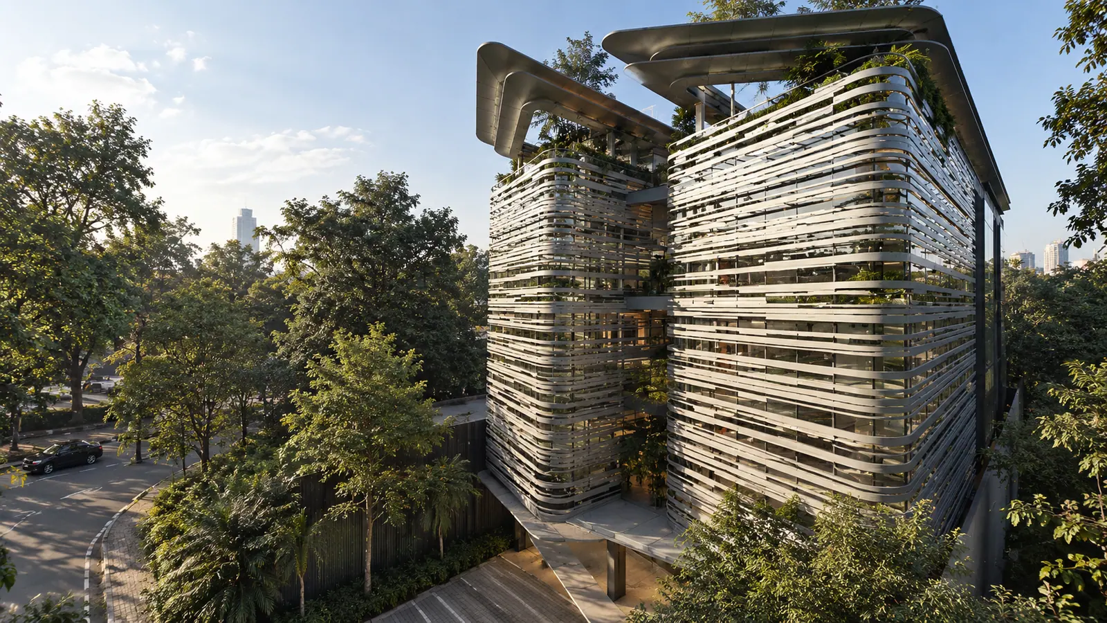 Metro Rent Office, Jakarta: louvered facade towers among trees